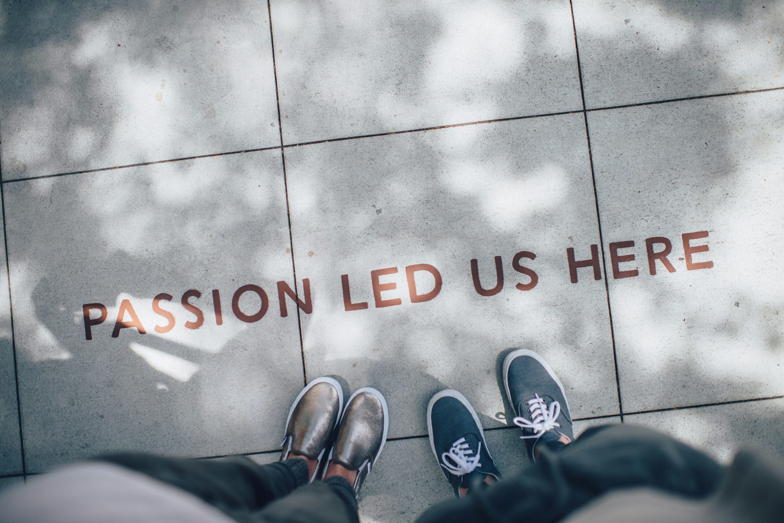 Company culture, passion led us here on a tiled floor with two sets of male shoes